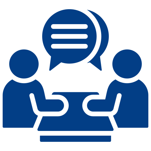 Two people discussing at a table.